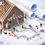 building house on blueprints with worker - construction project building house on blueprints with worker - construction project