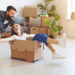 happy young married couple moves to new apartment a happy young married couple moves to new apartment